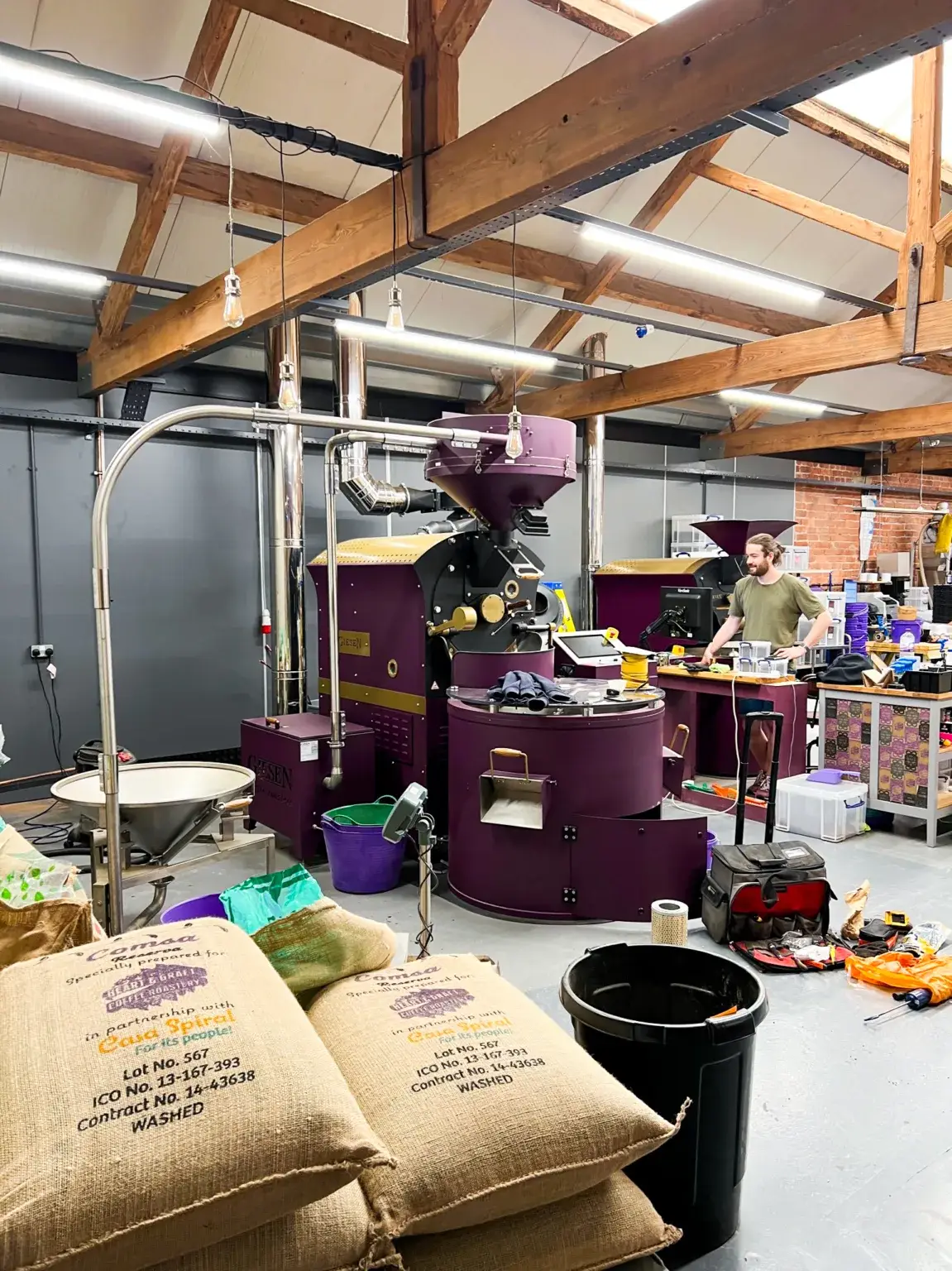 A custom purple Giesen roaster running in a working specialty roastery